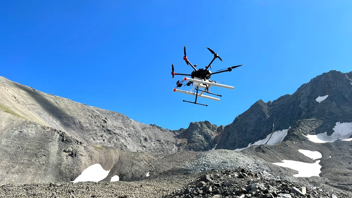 A drone above a rocky area.