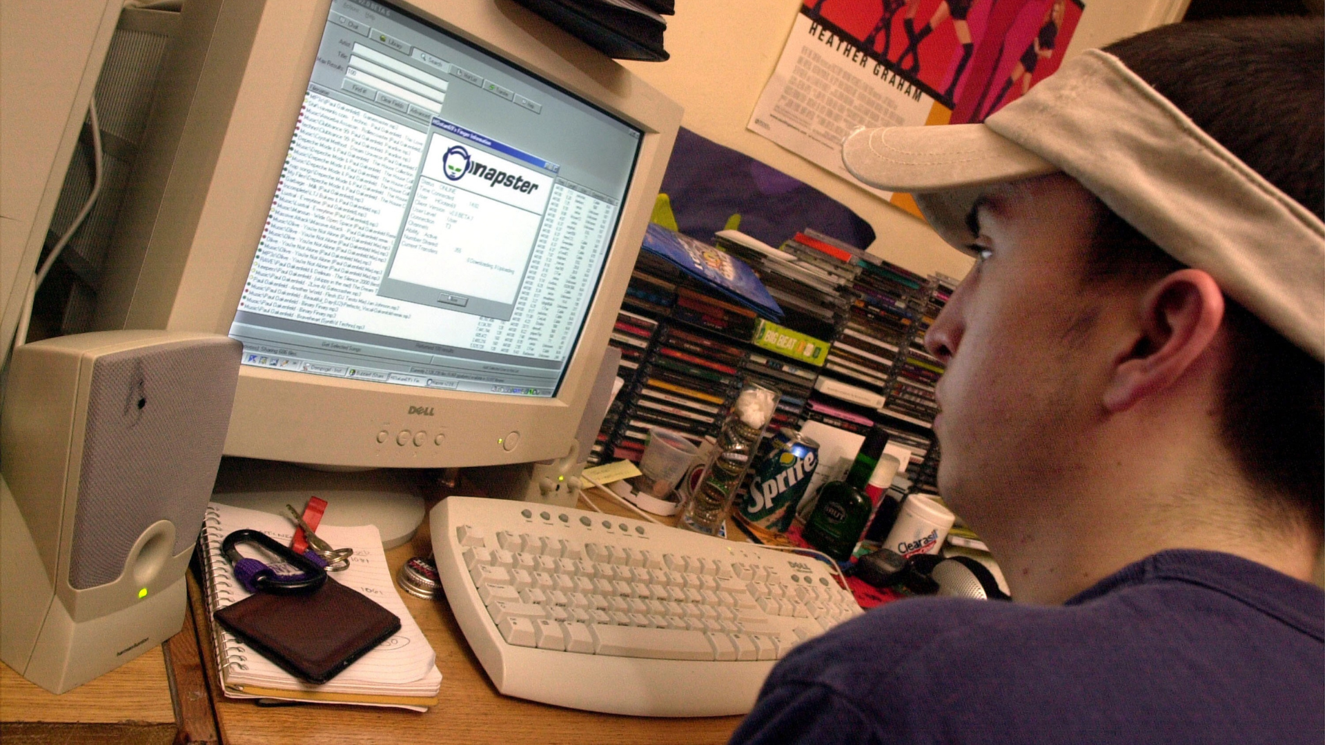 a person pirating music from the internet using Napster from the early 2000s