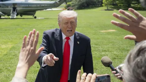 President Donald Trump speaks to the press before departing the White House for Florida on May 1, 2026, in Washington DC