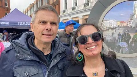 Neil and Ana Ball are looking at the camera from Ipswich town centre, in front of the 