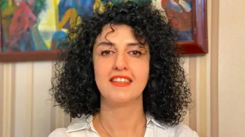 Undated picture of Narges Mohammadi provided by her family, showing smiling with uncovered hair  